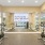 The fitness center at our apartments for rent in Stamford, CT, featuring spin bikers, cardio machines, and mirrored walls.