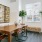 a dining room table with chairs and a plant on it