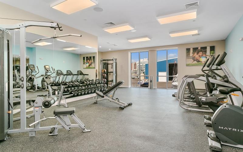 The fitness center at our apartments for rent in Stamford, CT, featuring free weights, exercise balls, and other equipment.