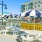 Outdoor lounge at our apartments for rent in Stamford, CT, featuring adirondack chairs, umbrellas, and grill stations.