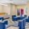 Resident lounge and lobby at our apartments for rent in Stamford, CT, featuring wood grain flooring and a front desk.