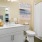 a bathroom with a large painting