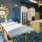 Resident lounge at our apartments for rent in Stamford, CT, featuring carpeted flooring, counter seating, and a kitchen.