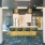 Resident lounge at our apartments for rent in Stamford, CT, featuring carpeted flooring, counter seating, and a kitchen.