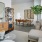 a living room with a table and chairs