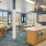 Resident lounge at our apartments for rent in Stamford, CT, featuring carpeted flooring, ample seating, and coffee tables.